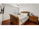 Comfortable bedroom with ceiling fan, window, and hardwood floors at 3536 Moss Pointe Pl, Lake Mary, FL 32746