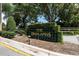 Attractive community sign for 'The Highlands' surrounded by lush landscaping, enhancing curb appeal at 3536 Moss Pointe Pl, Lake Mary, FL 32746
