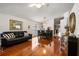 Inviting dining area featuring polished hardwood floors, a stylish chandelier, and comfortable seating at 3536 Moss Pointe Pl, Lake Mary, FL 32746