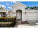 Inviting front entrance of home showing the front door, and a two-car garage at 3536 Moss Pointe Pl, Lake Mary, FL 32746