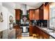 Modern kitchen with stainless steel appliances, granite countertops, island, and ample cabinet space at 3536 Moss Pointe Pl, Lake Mary, FL 32746