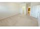 Spacious bedroom with neutral walls, carpet, and access to a walk-in closet and bathroom at 4120 Juliana Lake Dr, Auburndale, FL 33823