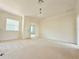 Spacious bonus room with neutral carpet, ample natural light, and crown molding at 4120 Juliana Lake Dr, Auburndale, FL 33823