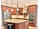 Gourmet kitchen with granite countertops, stainless steel appliances, and a center island with seating at 4120 Juliana Lake Dr, Auburndale, FL 33823