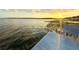 Scenic view of Lake Juliana at sunset from a dock, offering peaceful waterfront living at 4120 Juliana Lake Dr, Auburndale, FL 33823