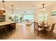 Open-concept design includes dining space that overlooks the living room and kitchen at 4120 Juliana Lake Dr, Auburndale, FL 33823