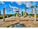 Community playground with multiple play structures, swings, and ample space for outdoor fun for all ages at 4120 Juliana Lake Dr, Auburndale, FL 33823