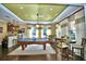 Well-lit recreation room featuring a billiard table, kitchenette, and seating area for residents and guests at 4120 Juliana Lake Dr, Auburndale, FL 33823