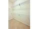 Spacious walk-in closet offering ample storage with multiple wire shelves and tile flooring at 4120 Juliana Lake Dr, Auburndale, FL 33823