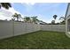 Backyard view featuring privacy fences and lush green grass at 4404 Gwyndale Ct, Orlando, FL 32837