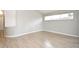 Neutral bedroom features sleek wood-look flooring and natural light from large windows at 4404 Gwyndale Ct, Orlando, FL 32837