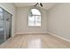 Bedroom showcasing tile floors, high ceilings, a large arched window, and sliding glass doors at 4404 Gwyndale Ct, Orlando, FL 32837