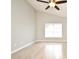 Bedroom featuring wood-look flooring, a ceiling fan with integrated lighting, and a window at 4404 Gwyndale Ct, Orlando, FL 32837