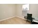 Small bedroom features wood-look tile flooring and a camping chair at 4404 Gwyndale Ct, Orlando, FL 32837