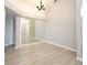 Dining room featuring a wall mirror and wood-look tile flooring at 4404 Gwyndale Ct, Orlando, FL 32837