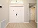 Inviting entryway features a double front door, complemented by stylish flooring at 4404 Gwyndale Ct, Orlando, FL 32837