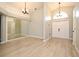 Open foyer featuring tile floors, high ceilings, modern chandelier and sidelight window at 4404 Gwyndale Ct, Orlando, FL 32837