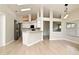 Open-concept kitchen with sleek appliances, white cabinetry, and lots of natural light at 4404 Gwyndale Ct, Orlando, FL 32837