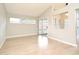 Airy living room with tile floors, large window, and sliding glass doors leading to the outside at 4404 Gwyndale Ct, Orlando, FL 32837