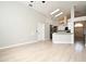 Open living area showcasing tile floors and sightlines to the kitchen and breakfast bar at 4404 Gwyndale Ct, Orlando, FL 32837