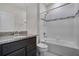 Bathroom features a granite countertop vanity and a bathtub with a tiled shower at 5089 Caspian St, St Cloud, FL 34771