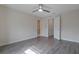 The bedroom features a ceiling fan, wood-look flooring, and access to the bathroom at 5089 Caspian St, St Cloud, FL 34771
