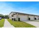 Exterior facade of the apartment complex with garage doors at 5089 Caspian St, St Cloud, FL 34771