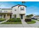 Charming two-story townhome features a well-manicured lawn and inviting entryway at 5089 Caspian St, St Cloud, FL 34771