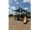 Community playground featuring a covered play structure with slides and climbing areas at 5089 Caspian St, St Cloud, FL 34771