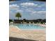 View of the community pool with lounge chairs, and a palm tree at 5089 Caspian St, St Cloud, FL 34771