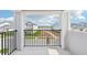 Balcony view of a neighborhood with pond and other homes from outdoor balcony at 5260 Citrus Leaf Blvd, Winter Garden, FL 34787