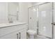 Modern bathroom features tiled shower and sink with stainless steel fixtures at 5260 Citrus Leaf Blvd, Winter Garden, FL 34787