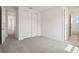 Bedroom features neutral carpeting and access to the other rooms in the house at 5260 Citrus Leaf Blvd, Winter Garden, FL 34787