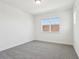 A naturally lit bedroom with a window overlooking a tile roof at 5260 Citrus Leaf Blvd, Winter Garden, FL 34787