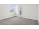 Bedroom features neutral carpeting, a window, and access to the balcony at 5260 Citrus Leaf Blvd, Winter Garden, FL 34787