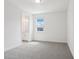 Bedroom features neutral carpeting and a window at 5260 Citrus Leaf Blvd, Winter Garden, FL 34787