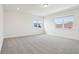 Spacious bedroom with two windows showing the neighborhood view at 5260 Citrus Leaf Blvd, Winter Garden, FL 34787