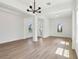 Bright dining room featuring hardwood floors, modern lighting, and a welcoming atmosphere at 5260 Citrus Leaf Blvd, Winter Garden, FL 34787