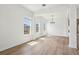 Spacious dining area with hardwood floors, white walls, and modern chandelier at 5260 Citrus Leaf Blvd, Winter Garden, FL 34787