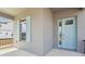 Inviting light-blue front door and decorative shutters of home at 5260 Citrus Leaf Blvd, Winter Garden, FL 34787