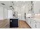 Modern kitchen featuring white cabinets, stainless steel appliances, and a large island at 5260 Citrus Leaf Blvd, Winter Garden, FL 34787