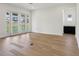 Hardwood-floored living room offering a bright space with access to an outdoor patio at 5260 Citrus Leaf Blvd, Winter Garden, FL 34787