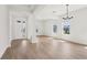 Bright, open-concept living room with wood flooring and plenty of natural light at 5260 Citrus Leaf Blvd, Winter Garden, FL 34787