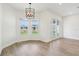 Open-concept living area with hardwood floors, french doors and plenty of natural light at 5260 Citrus Leaf Blvd, Winter Garden, FL 34787