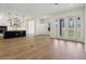 Expansive living area merging modern kitchen with a well-lit open layout and outdoor access at 5260 Citrus Leaf Blvd, Winter Garden, FL 34787