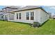 Well-maintained backyard with manicured lawn and partial home exterior view at 5290 Citrus Leaf Blvd, Winter Garden, FL 34787