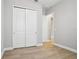 A clean bedroom offers ample space and storage, featuring a double door closet at 5290 Citrus Leaf Blvd, Winter Garden, FL 34787