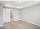 Clean bedroom with tray ceilings and entrance into the ensuite bathroom at 5290 Citrus Leaf Blvd, Winter Garden, FL 34787