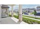 Spacious front porch with stone-accented columns overlooking the beautifully landscaped street at 5290 Citrus Leaf Blvd, Winter Garden, FL 34787