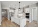 Bright kitchen with island, stainless steel appliances, and modern pendant lights at 5290 Citrus Leaf Blvd, Winter Garden, FL 34787